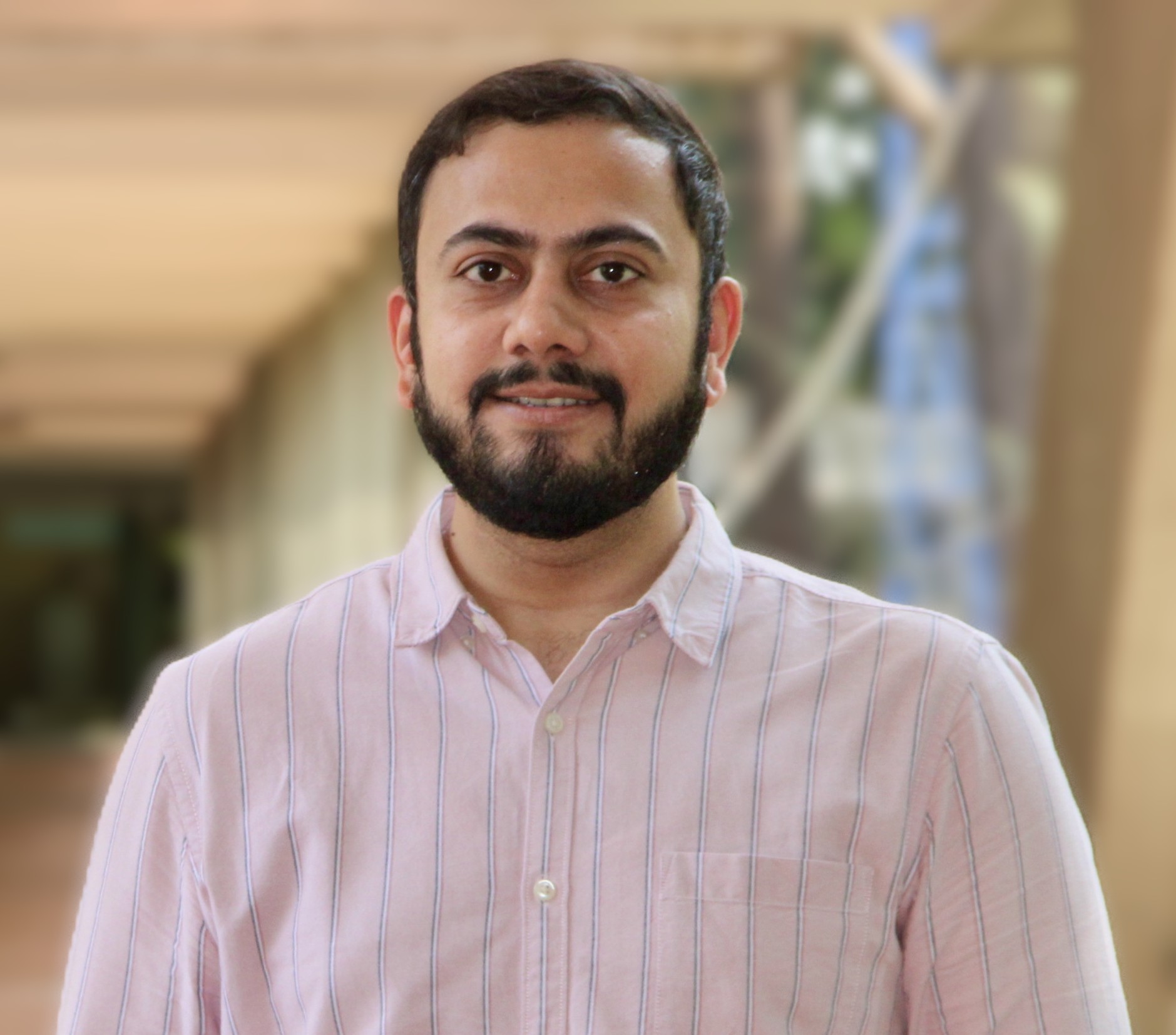 Professional portrait of financial researcher