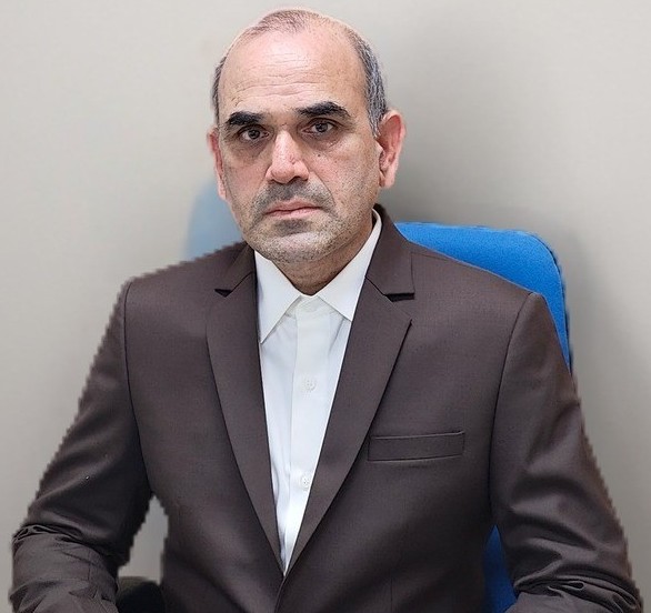 Professional portrait of financial researcher